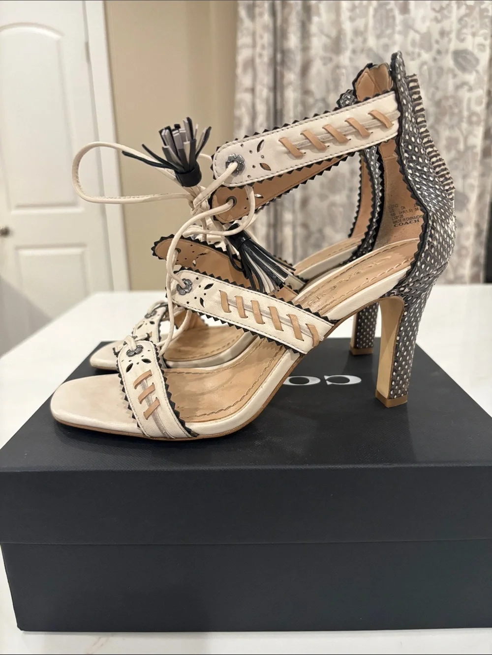 Coach Ivory and Black Studded Tassel High Heel Sandals